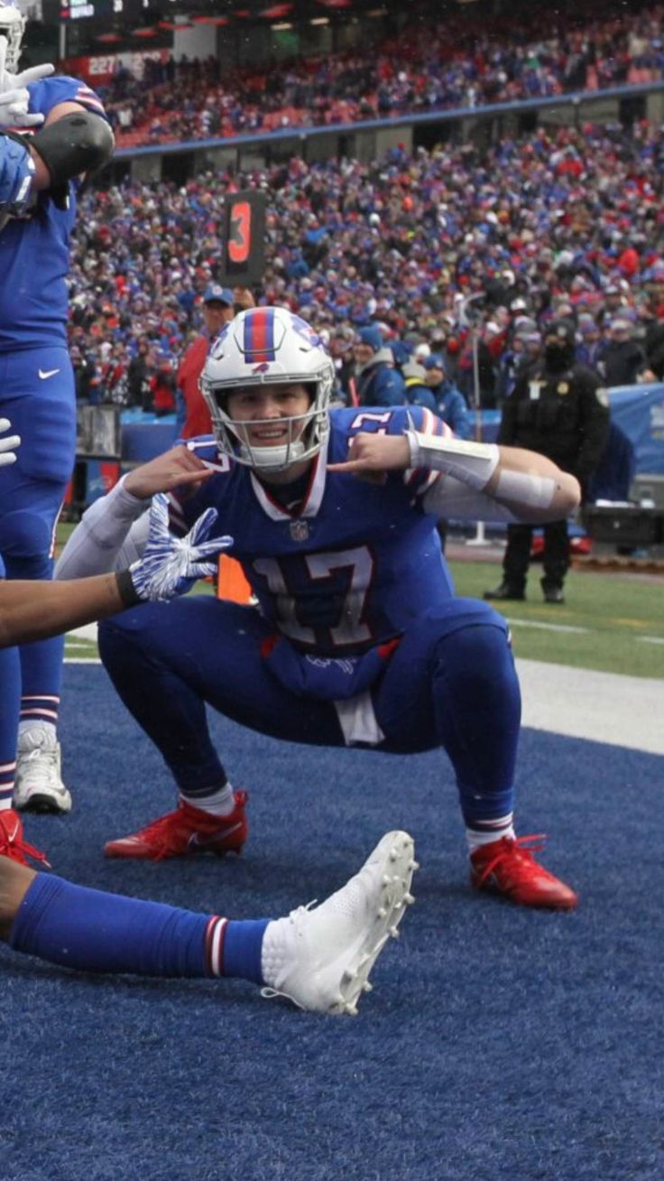 two football players are on the field during a game