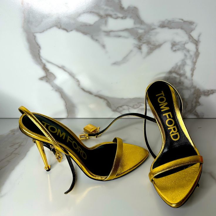 Authentic Tom Ford Lock Sandal. Sz 36 Fits Closer To 35.5 Or 35 Depending On Foot Dimension . Only Worn Once . Look Brand New . Comes With Original Packaging. Calf Leather Pointed Toe Party Sandals, Pointed Toe Calf Leather Party Sandals, Pointed Toe Calf Leather Sandals For Party, Party Sandals In Calf Leather With Pointed Toe, Luxury Heels With Heel Strap And Single Toe Strap, Gold Leather Heels For Evening, Designer Calf Leather Heels With Single Toe Strap, Calf Leather High Heel Sandals For Party, Luxury Heels With Single Toe Strap And Branded Insole