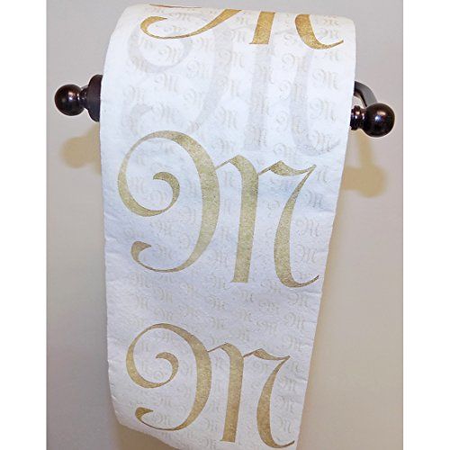 a white and gold towel hanging on a wall