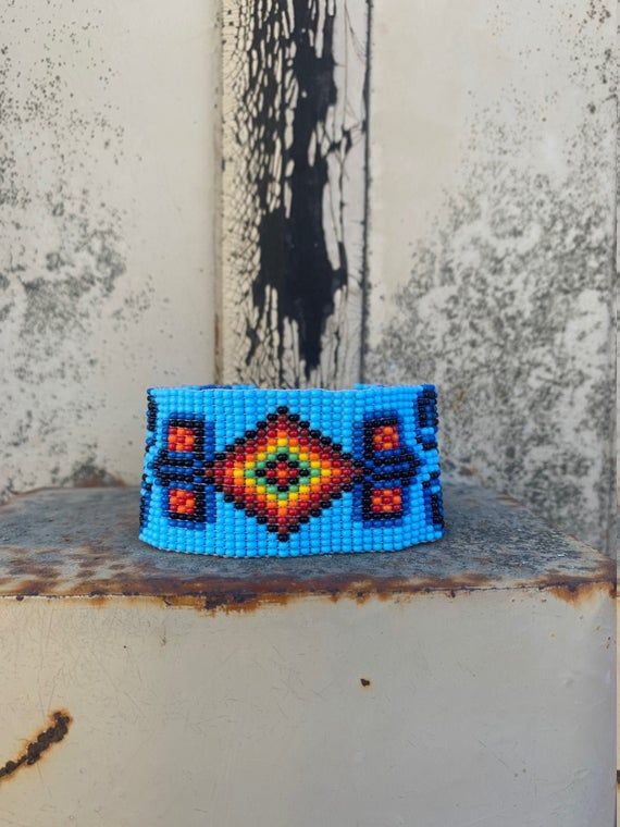 Handmade Bracelets, Handcrafted Jewelry, Beaded Woven Bracelet, Blue Multi Colored Beads, Casual Wristband 1.25 x 7.5 InchSparkly seed beads where used to create this beautiful beaded bracelet.*Casual Wear Beaded Bracelet*Native American Inspired Design*The bracelet can be secured at one of three lengths with a beaded button.*Handmade in Guatemala Beaded Hat Bands, Bead Woven Bracelet, Beautiful Beaded Bracelet, Beaded Hat, Aztec Fashion, Woven Bracelet, Girls Handmade, Jewelry Beaded, Bracelet Blue