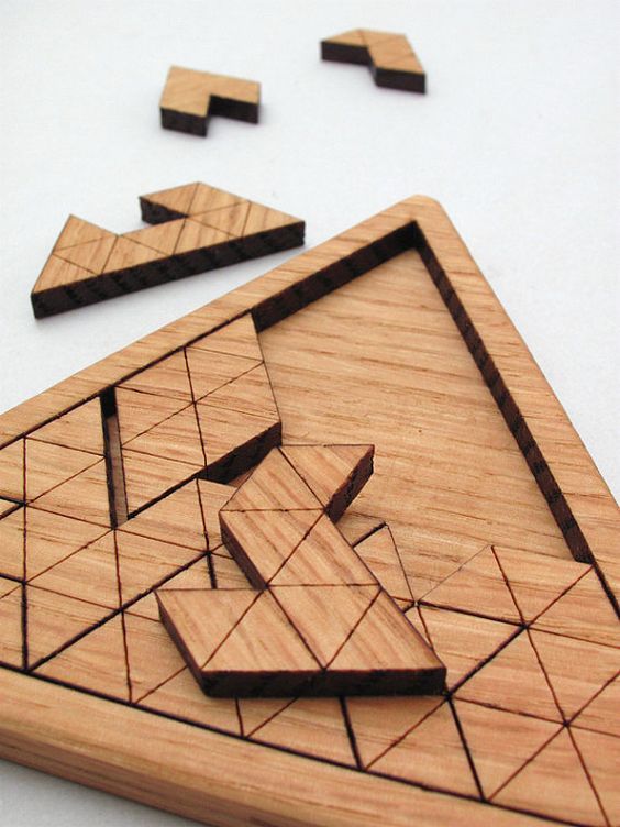 a wooden puzzle with pieces missing from it