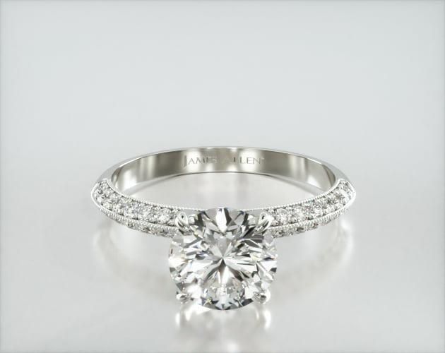 a diamond engagement ring on a white background