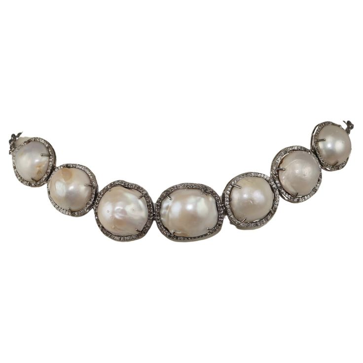 This gorgeous piece of Jewel consists of: Diamond- Pave diamonds Diamond origin- Natural Diamond color- White with a tint of grey Diamond wt- 4.80cts Gemstone - Pearl Gemstone type- Baroque pearl Gemstone origin- Natural Metal- Silver Metal purity- 925 / sterling silver Metal color- Oxidized silver Diamonds Necklace, Grey Diamond, Pearl Gemstone, Silver Pearls, Baroque Pearls, Sterling Silver Necklace, Pave Diamonds, Sterling Silver Necklaces, Colored Diamonds