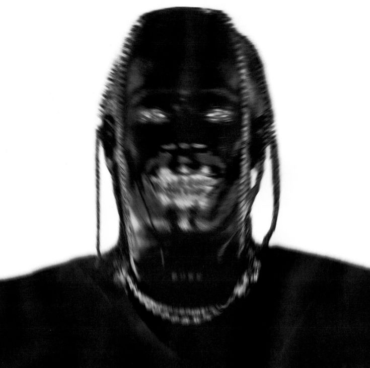 a black and white photo of a person with an alien head