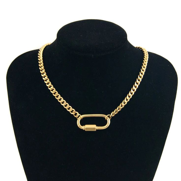 Make a statement and stand out in the crowd with the Atlas Necklace. This statement piece features a chunky curb chain, meticulously crafted from high-quality, water and tarnish-resistant stainless steel with a gleaming PVD gold plating. The secure carabiner clasp ensures a comfortable and confident wear. Rock it solo for a statement look or layer it with other necklaces for a personalized touch. Chunky Curb Chain PVD Gold Plated Stainless Steel Secure Carabiner Clasp Water & Tarnish Resistant 1 Cuban Link Stainless Steel Necklace With Gold Chain, Metal Cuban Link Chain Necklace With Lobster Clasp, Modern Metal Cuban Link Necklace, Trendy Jewelry With Carabiner Clasp, Trendy Everyday Jewelry With Carabiner Clasp, Trendy Chain Necklace With Lobster Clasp, Chunky Chain Metal Cuban Link Necklace, Metal Cuban Link Necklace With Adjustable Chain, Cuban Link Metal Necklace With Adjustable Chain