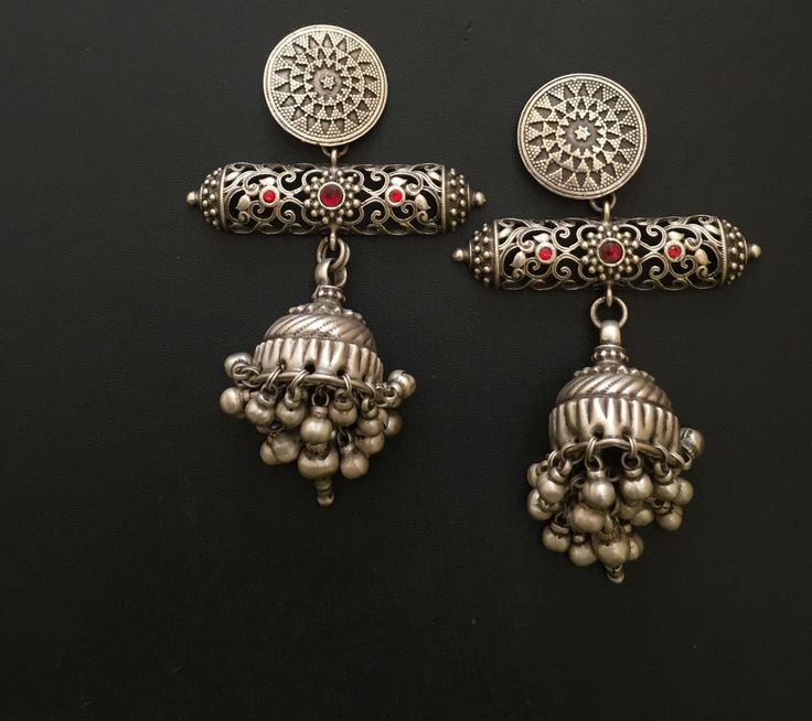 These earrings effortlessly capture the rich cultural heritage of Mughal jewelry, known for its grandeur and sophistication. The meticulous attention to detail and the incorporation of traditional design elements make them a timeless accessory that can be passed down through generations. Materials:  Silver  Style: Traditional Description:-  Antique silver 925, Gemstone Engagement , Anniversary , Honeymoon, First Date for Women, Traditional Earring - Jhumki , Gift for Her Metal :- SOLID 925 sterl Traditional Intricate Design Jhumkas For Festivals, Traditional Jhumkas With Intricate Design For Festivals, Traditional Intricate Jhumkas For Festivals, Traditional Dual-tone Danglers, Traditional Jhumkas With Intricate Design For Ceremonial Use, Traditional Ceremonial Intricate Jhumkas, Traditional Intricate Jhumkas For Ceremonial Occasion, Navratri Round Jhumkas With Intricate Design, Traditional Intricate Design Jhumkas For Festive Season