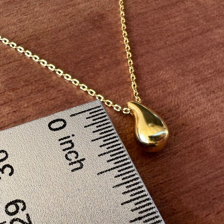 Showcase you love of water with our stunning and modern Wai Raindrop pendant. Water is life in Hawaii and this beautifully designed pendant is sure to add elegance and sophistication to any outfit. .925 Sterling Silver Approx. 1/2" Tall Available in 14K Gold Plated or Silver Includes 18" Adjustable chain w/1" extension Modern Teardrop Necklace For Anniversary, Modern Hypoallergenic Drop Jewelry, Teardrop Shaped Jewelry With Shiny Finish For Anniversary, Modern Teardrop Pendant Necklace Tarnish Resistant, Modern Gold Teardrop Pendant, Modern Tarnish-resistant Teardrop Pendant Necklace, Minimalist Teardrop Pendant Drop Gift, Modern Hypoallergenic Teardrop Pendant Jewelry, Modern Sterling Silver Teardrop Pendant Necklace