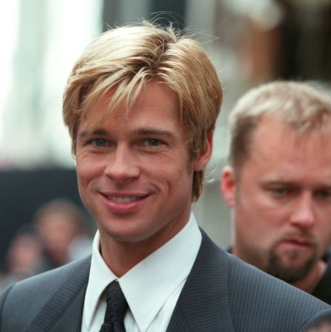 a man with blonde hair wearing a suit and tie