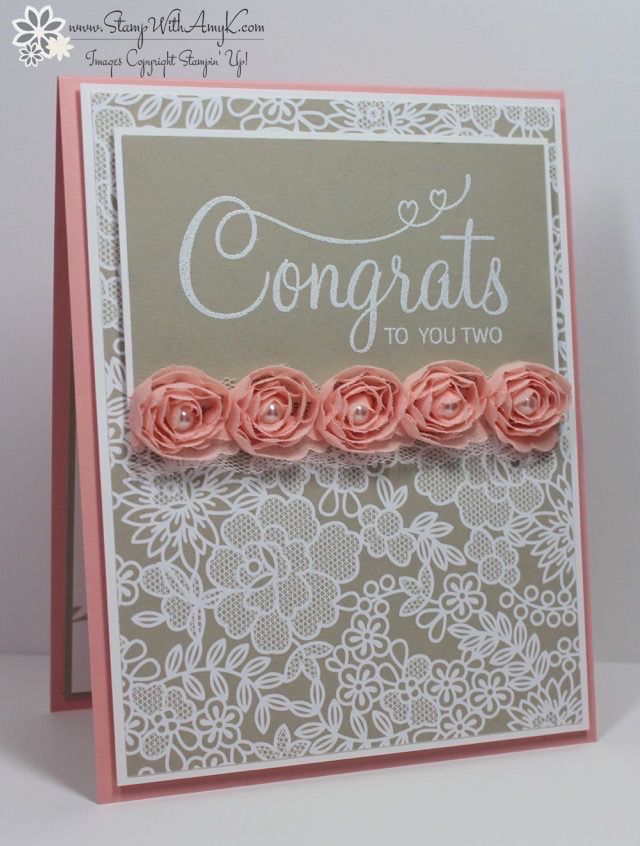 a card with pink flowers on it and congratulations written in white lettering, along with the words congrats to you two