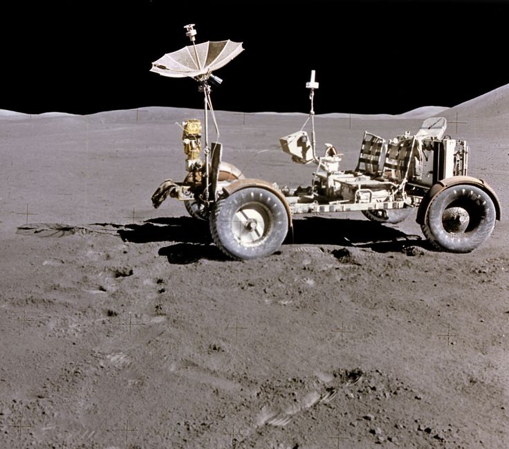 an astronaut's vehicle on the surface of the moon