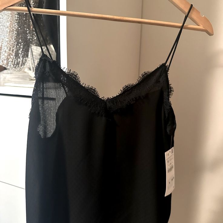 Beautiful Black Camisole From Zara With Faint In The Fabric. Size Medium Nwt Elegant Black Tank Top With Adjustable Straps, Black V-neck Top With Delicate Straps, Elegant Black Top With Adjustable Straps, Chic Cami Tank Top With Lace Trim, Chic Camisole With Lace Trim And Tank Straps, Chic Sleeveless Camisole With Lace Trim, Elegant Black Camisole With Tank Straps, Chic Sleeveless Lace Top Camisole, Chic Lace Trim Tank Top