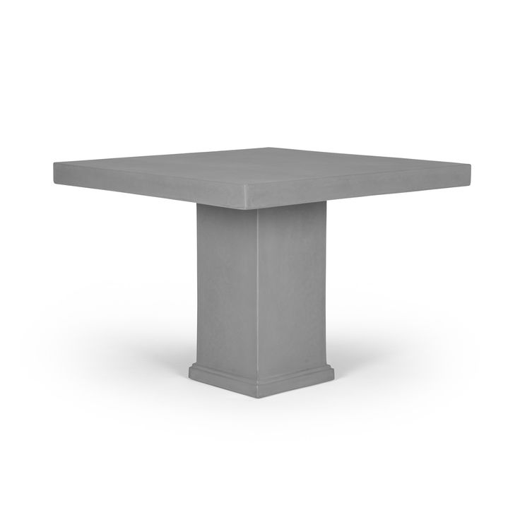 a square table with a pedestal base on the top and one leg in grey concrete