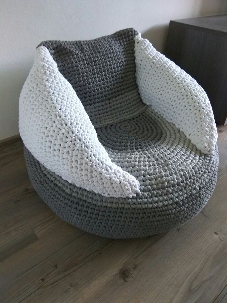 a grey and white crocheted bean bag chair