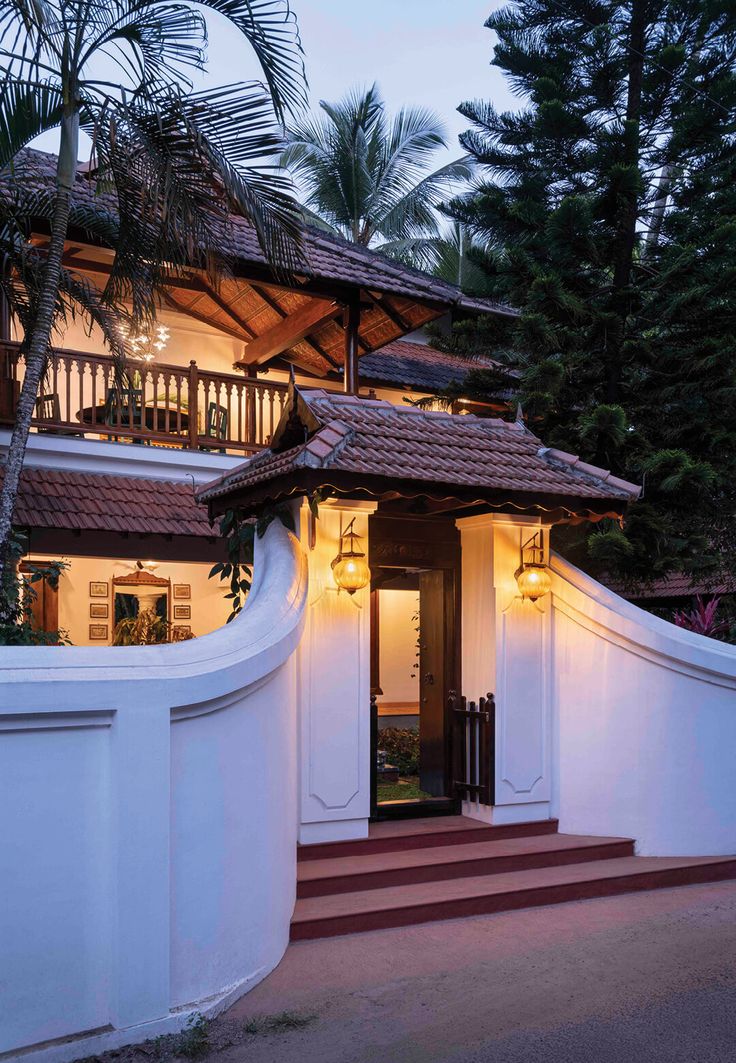 the entrance to a house with stairs leading up to it