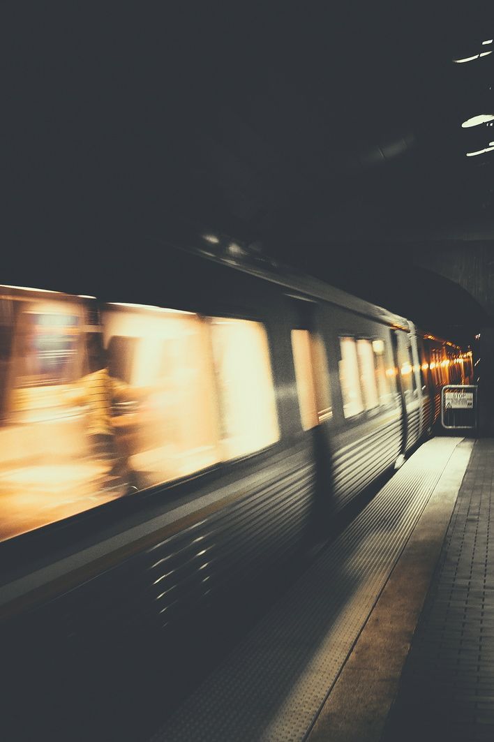 the train is moving fast through the station