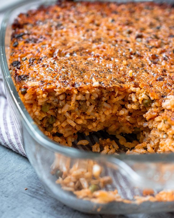 a casserole dish filled with rice and meat