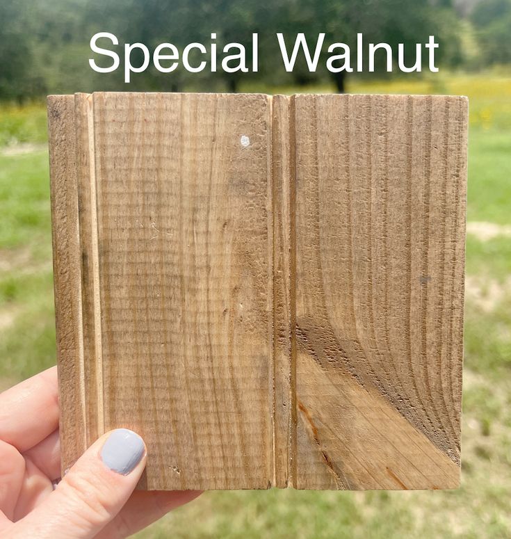 a hand holding a piece of wood with the words special walnut in front of it