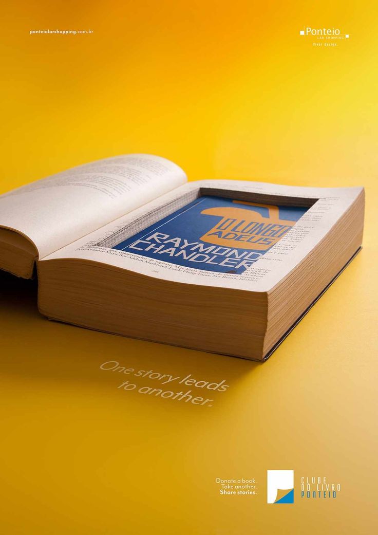 an open book sitting on top of a yellow table