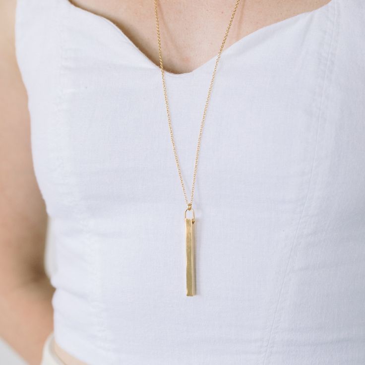 A fun version of the traditional bar necklace, the Coordinate Vertical Bar Necklace will help you keep a favorite place close to your heart. The vertical bar is custom engraved with your choice of coordinates, making it the perfect gift for graduations, weddings, engagements, and more. Available in 14k gold plated, rhodium plated or 14k rose gold plated brass Bar size: 2" by 3/16" 30" cable chain with 2" extender Lobster claw closure With engraving this item is FINAL SALE SKU: BYN1100 Minimalist Rectangular Bar Necklace As Personalized Gift, Minimalist Rectangular Bar Necklace For Personalized Gift, Minimalist Rectangular Pendant Bar Necklace For Personalized Gift, Traditional Bar, Vertical Bar Necklace, Brass Bar, Vertical Bar, Roman Numeral, Rose Gold Necklace