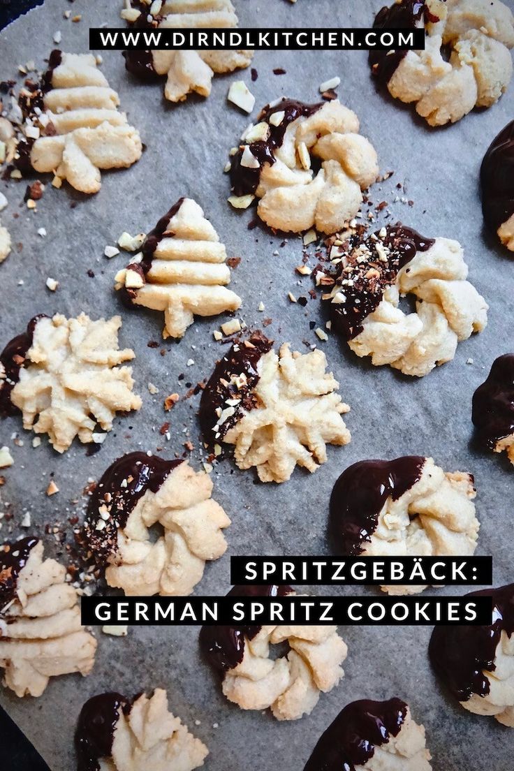 cookies with chocolate and sprinkles are on a baking sheet, ready to be baked