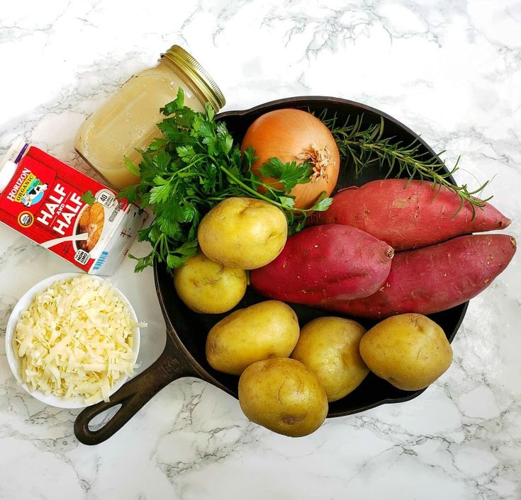 potatoes, radishes, carrots and other vegetables are arranged in a frying pan