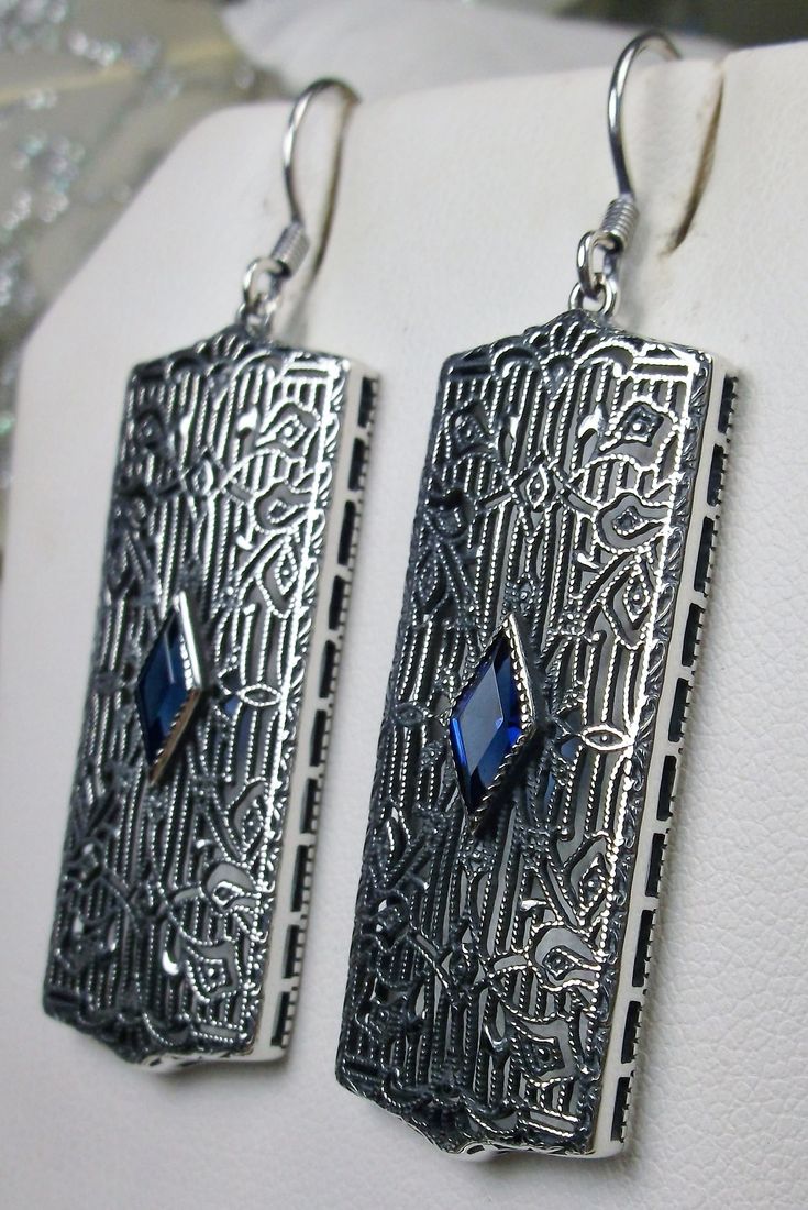 Rectangle Art Deco style earrings with fine lace filigree and a diamond shaped blue sapphire gemstone in the center of the lace filigree field, traditional shepherd hook style ear wire closures Vintage Nickel-free Earrings For Evening, Nickel-free Vintage Earrings For Evening, Art Deco Metal Earrings For Evening, Classic Silver Pierced Plug Earrings, Art Deco Drop Earrings For Evening, Vintage Nickel-free Jewelry For Evening, Nickel-free Vintage Jewelry For Evening, Nickel Free Vintage Jewelry For Evening, Antique Nickel-free Earrings For Party