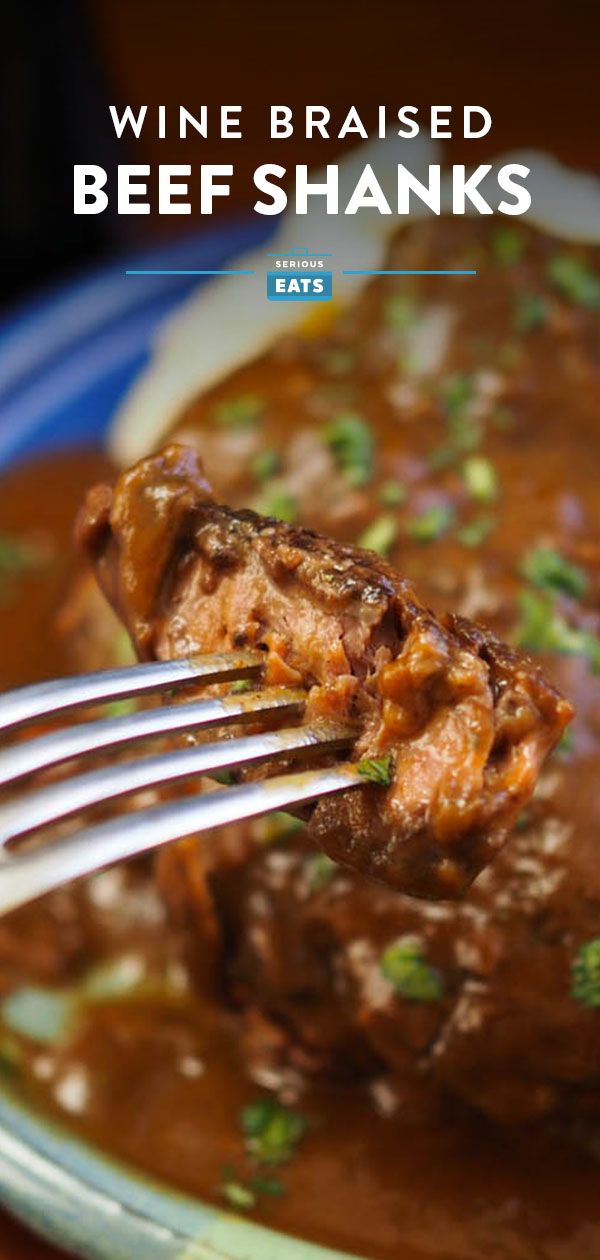 a close up of a fork in a bowl of food with beef shanks on it