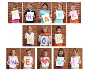 children holding up letters that spell out the word thank