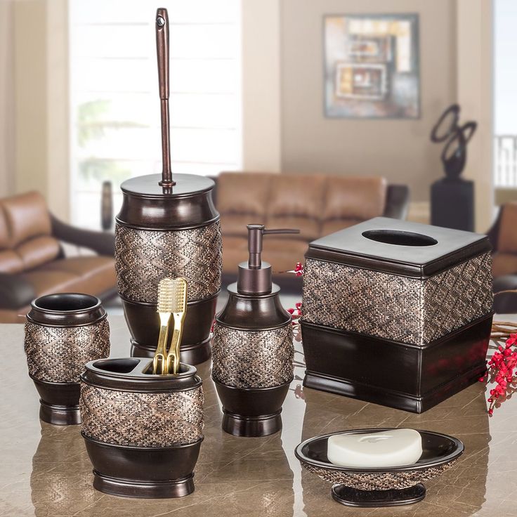 the bathroom accessories are on the table in the living room, and it is decorated with gold accents