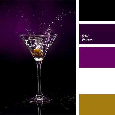 a martini glass with an orange peel splashing out of it and the color scheme is purple