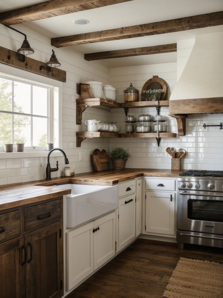 a kitchen with white cabinets and wooden shelves