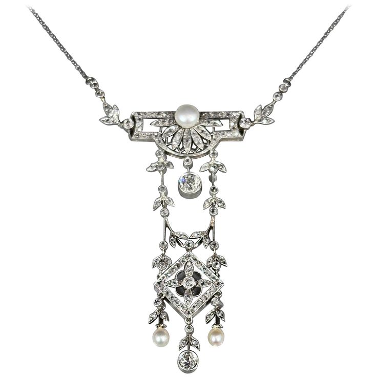 Antique La Belle Époque natural pearl and diamond pendant necklace in platinum and gold, Portuguese, circa 1900. This garland jewel of geometric, floral and foliate motifs is millegrain-set throughout with natural pearls and Old European brilliant-cut and rose-cut diamonds. Typical of the Edwardian period, the pendant is composed by a geometric openwork cartouche surmount issuing an articulated swag embellished with a squared openwork plaque and with three articulated drops – two with natural pe Luxury Victorian Flower Pendant Necklace, Luxury Heirloom Pearl Pendant Jewelry, Art Deco White Gold Necklace With Rose Cut Diamonds, Cabin Door, Pearl Diamond Pendant, Glamour Nails, Edwardian Jewelry, Gold For Sale, Big Diamond