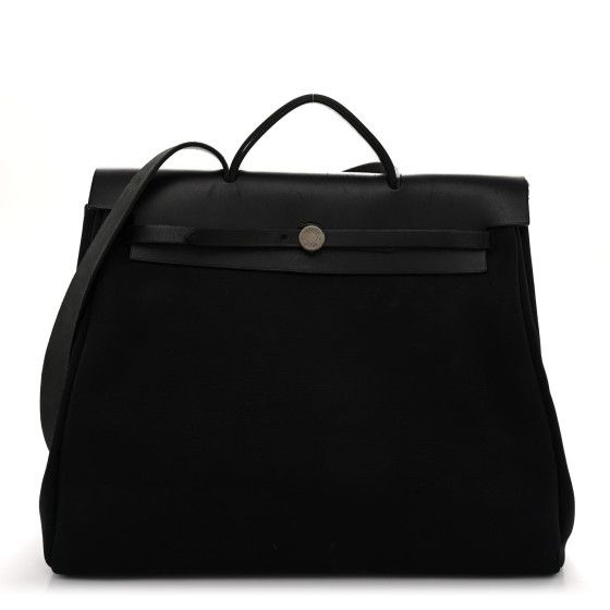 This is an authentic HERMES Toile Vache Calfskin Herbag 39 MM in Black. This stylish bag is crafted of black toile canvas. The bag features a black leather crest with leather top handles, a shoulder strap, and polished palladium plated hardware. The opens to a black fabric interior with a removable pouch. Designer Canvas Bag With Detachable Handle For Travel, Luxury Black Rectangular Canvas Bag, Designer Top Handle Canvas Bag For Travel, Designer Canvas Travel Bag With Top Handle, Designer Travel Canvas Bag With Top Handle, Luxury Canvas Bag With Top Handle, Black Shoulder Bag With Leather Handles And Coated Canvas, Black Coated Canvas Shoulder Bag With Leather Handles, Luxury Black Canvas Bag For Everyday