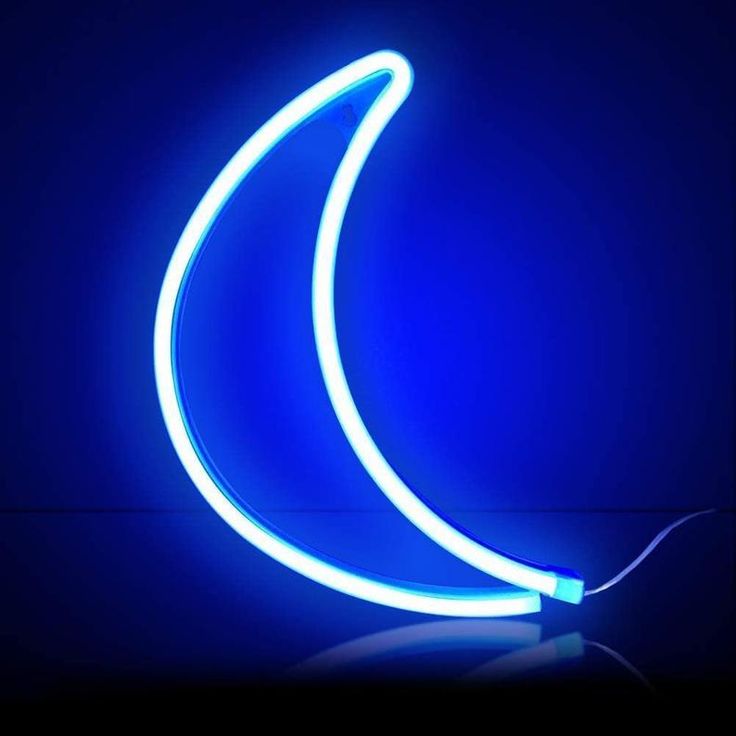 a blue neon banana sitting on top of a table