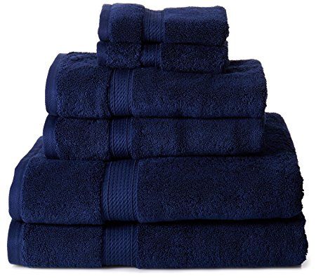 towels stacked on top of each other in dark blue colors with white trimmings