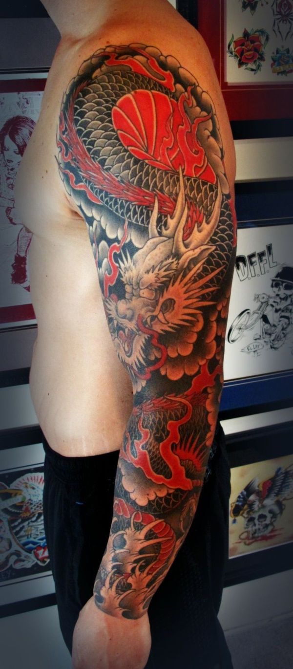 a man with a dragon tattoo on his arm