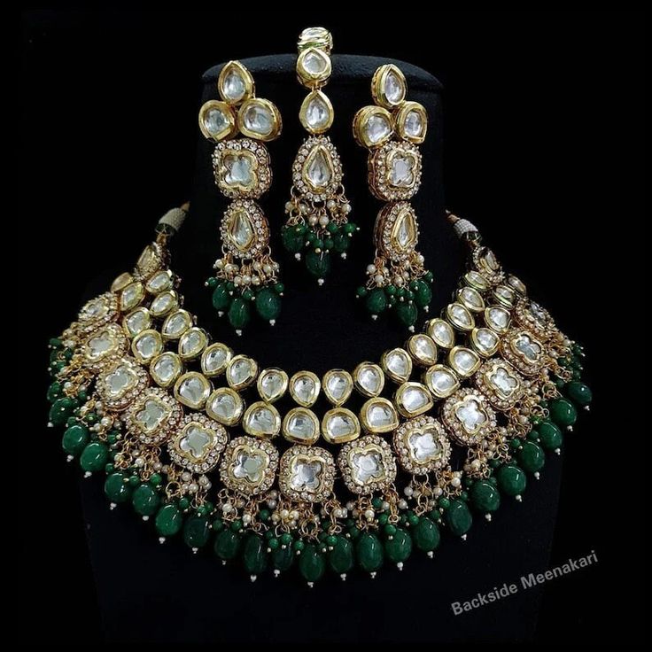 * The base metal color is Gold tone studded with kundan along with beads work on it. * This Jewelry set would add more charms to your beautiful jewelry collection and would surely bring lots of compliments . * Note:- This is an artificial Jewelry Set. * Care Instructions: Keep it dust-free & dirt free in a plastic pouch. Remember to apply your hairspray, perfume, and cosmetics before putting your jewellery on. The measurement and color may be different slightly (We are not responsible for custom Emerald Green Bridal Jewelry Indian, Bridal Choker Set, Bridal Jewellery Inspiration, Kundan Jewellery Bridal, Kundan Jewellery Set, Kundan Choker, Bridal Choker, Bridal Necklace Set, Indian Necklace