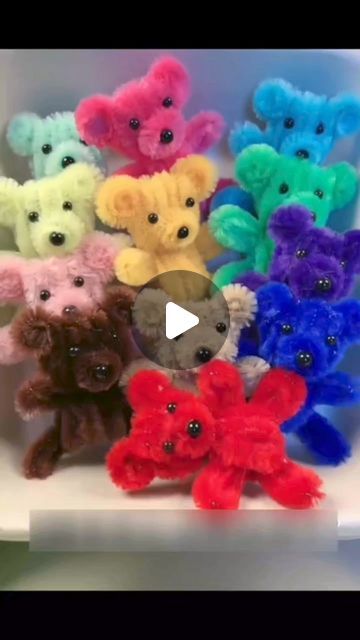 a group of stuffed animals sitting on top of a white shelf