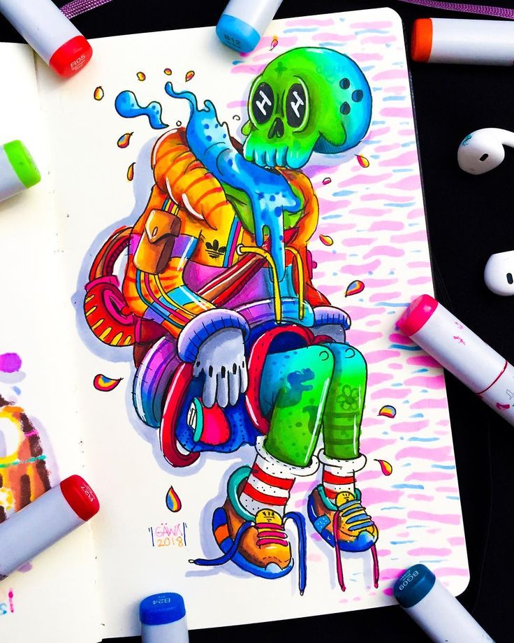 a drawing of an octopus sitting on top of a book next to crayons