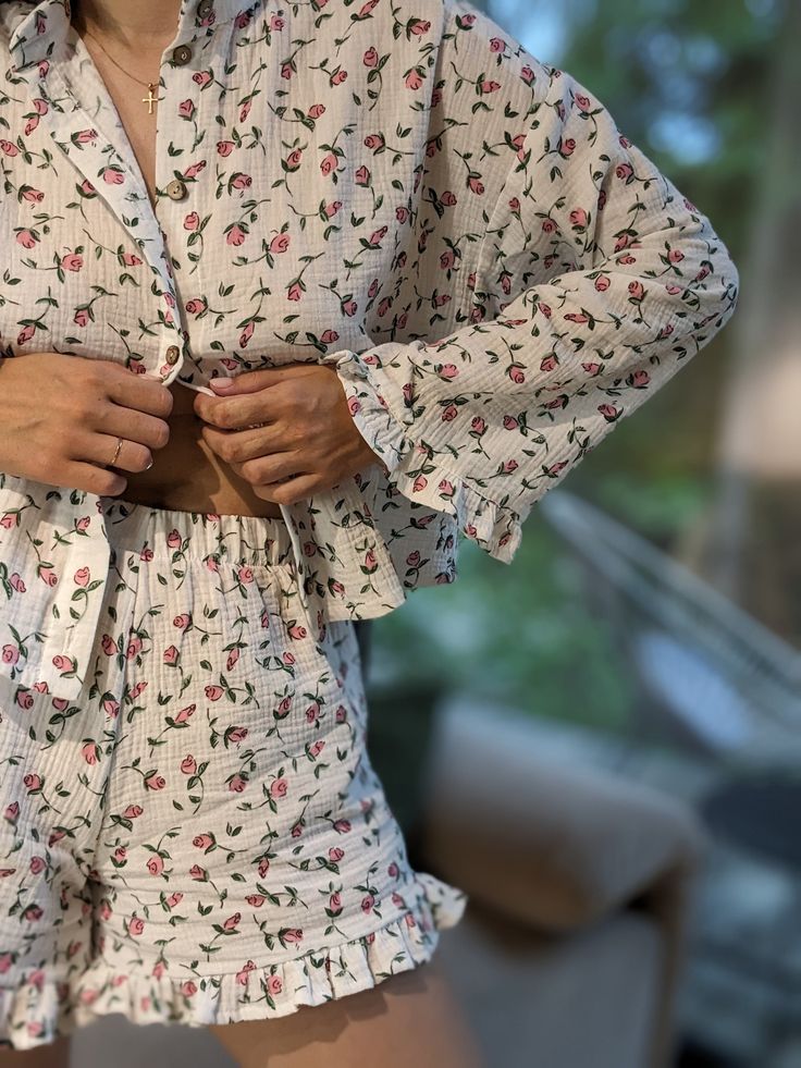 "My women's muslin pajamas are made from 100% organic cotton. Featuring a subtle rose print, these white pajamas will add charm and coziness to your sleepwear collection. A handcrafted night set is the perfect gift for her  for Christmas and other holidays, showcasing exquisite craftsmanship and attention to detail. The set includes shorts with elastic with frills and a shirt with ruffled sleeves. My holiday pajamas are not only stylish, but also provide maximum comfort, coziness and warmth. The use of natural fabric ensures breathability, is suitable for all temperatures and provides the perfect comfort that your skin deserves. This indispensable item in your wardrobe will continue to please you with its stunning appearance for many years to come. My pajamas suit most body types, making y Dainty Pajamas Aesthetic, Cottage Core Pyjamas, Cottagecore Pajamas Aesthetic, Cottage Core Pjs, Girly Pajama Set, Feminine Bedtime Sets For Spring, Feminine Long Sleeve Summer Sleepwear, Night Clothes Women, Women’s Pajamas