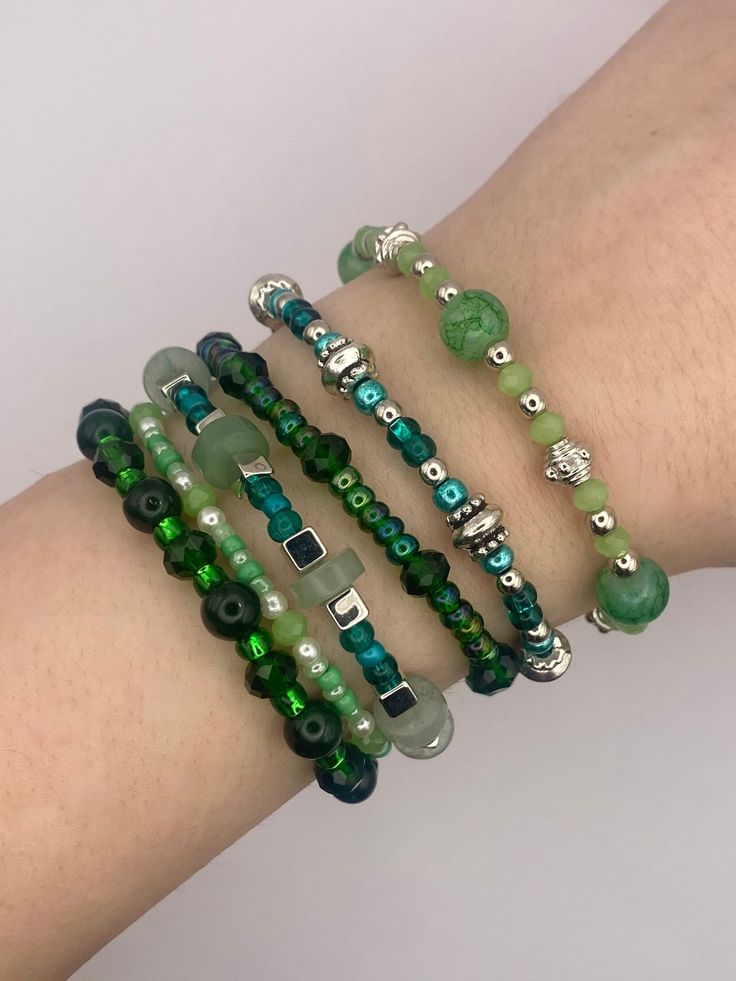 For those who prefer silver, this is the silver line of green beaded bracelets, each with a unique and special design. The charms dangle delicately on the wrist, and are combinable. Unique Green Beaded Bracelets, Cheap Green Beaded Bracelets, Cheap Green Bracelets, Cheap Hypoallergenic Green Bracelets, Cheap Green Holiday Bracelets, Cheap Green Beaded Bracelets For Birthday, Cheap Green Novelty Beaded Bracelets, Green Glass Bead Bracelet, Adjustable Green Stackable Beaded Bracelets