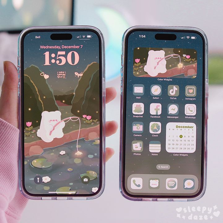 two iphones with the same screen size as they are being held in front of each other