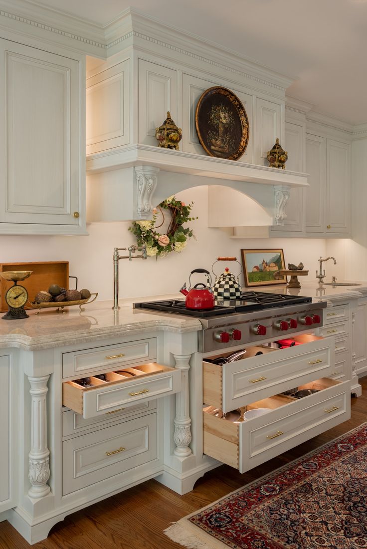 a kitchen with white cabinets and an oven