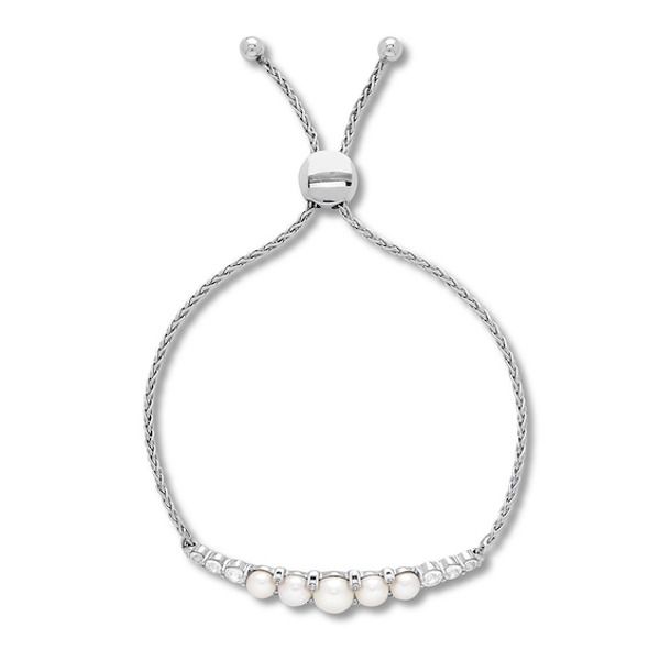 Graduated freshwater cultured pearls fan out on either side of this delightful bolo bracelet for her. Lab-created white sapphires add a splash of shimmer to the bracelet. The sterling silver wheat chain fastens with an bolo clasp that adjusts up to 9 inches in length.