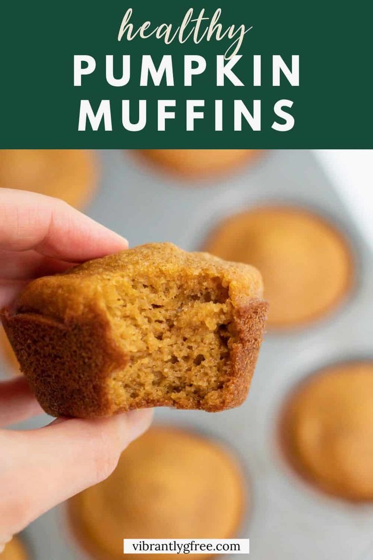 a person holding a muffin in their hand with the words healthy pumpkin muffins