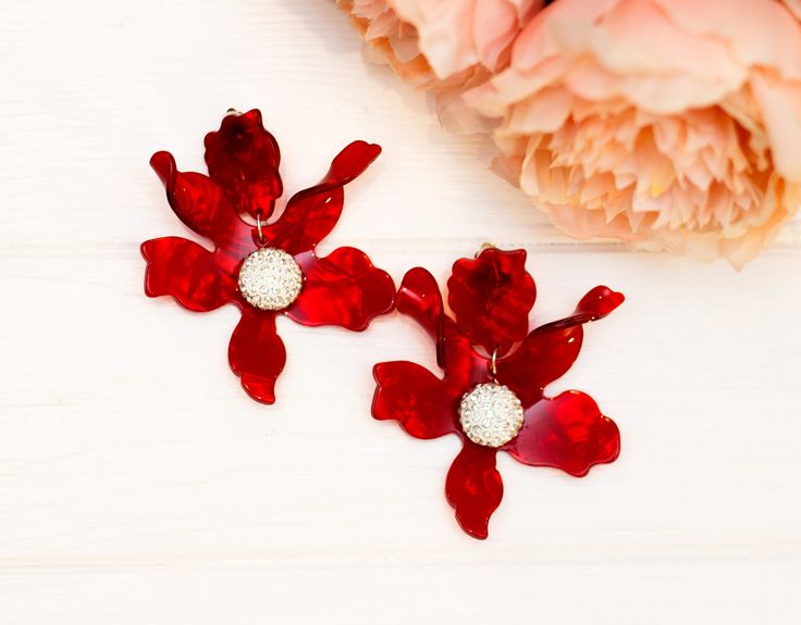 Red flowers earrings. Ideal for evening,weddings, parties, proms, photo shoots and on every day. Earrings made of high-quality crystal and acetate CUSTOM ORDER It is Fully HANDMADE earrings and if you want to purchase this earrings in a different color or size, send me please a direct message. If you have any questions don't be hesitate to ask me. Please visit my shop to see more models made by me https://www.etsy.com/shop/LaranBijou DIMENSIONS Length - 8cm (3 inch) Weight 15 grams Clip On earri Flower Drop Earrings For Party, Party Flower Drop Earrings, Elegant Red Flower Earrings For Party, Red Flower Earrings For Party, Elegant Red Flower Earrings, Red Flower Shape Earrings For Party, Red Jewelry With 3d Flower Details, Red Flower-shaped Earrings For Party, Red Flower Drop Earrings For Wedding