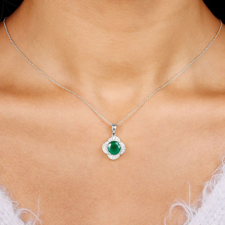 Product Details Be Dazzle with this Beautiful Flower Pendant embellished with Round Shape Created Emerald set in a Half Bezel Setting along with a Zircon Halo. Product Information SKU SHP-PENDANT0621102985 Length 19.5 mm Width 13.5 mm Weight 3.60 gm (Approximate) LAB CREATED EMERALD INFORMATION No.of Stones 1 Pieces Total Weight 2.18 Carat (Approximate) Dimension(approx) Round-8X8 mm-1 Pcs Color Green Cut Brilliant Shape Round Setting Type Half-Bezel-Setting Quality Grade AAAA ZIRCON INFORMATION Half Bezel Setting, Emerald Set, Necklace With Diamond, Half Bezel, Floral Pendant Necklace, Lab Created Emerald, Emerald Pendant, Floral Pendant, Flower Pendant