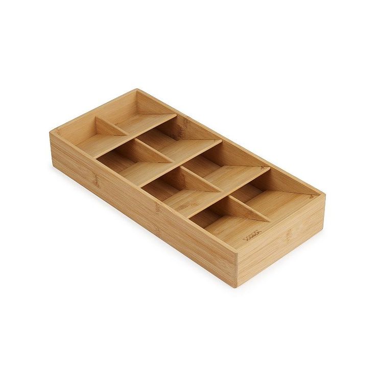 an empty wooden box with compartments in it