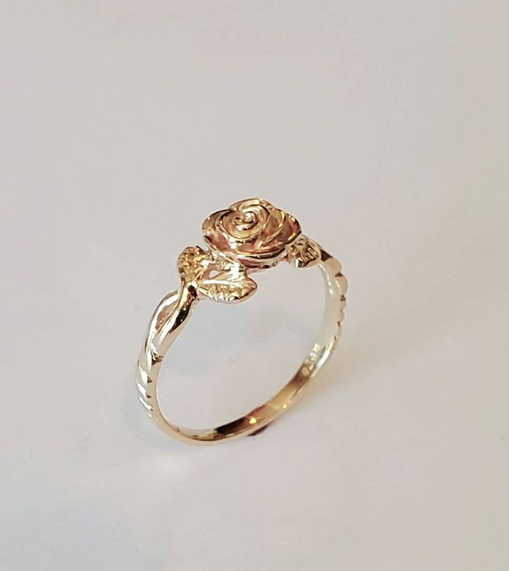 You are looking at a beautiful 14 carat yellow gold rose ring with leaves The ring is all hand carved paying close attention to detail One rose means love at 1st sight Can be ordered in white gold, yellow gold, rose gold, and platinum Can be ordered in sizes 4 to 9 Comes in a beautiful Box Money back guarantee Luxury Gold Flower Promise Ring, Affordable Rose Gold Flower Ring, Vintage Gold Rings Rose, Affordable Rose Gold Flower Ring Gift, Rose Gold Jewellery Rings, Cheap Rose Gold Flower Promise Ring, Cheap Rose Gold Flower Ring As Gift, Cheap Adjustable Rose Gold Flower Ring, Simple Rose Rings