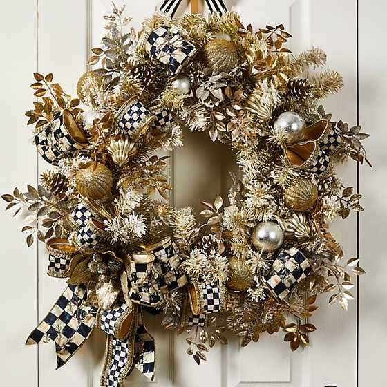 a wreath is hanging on the front door